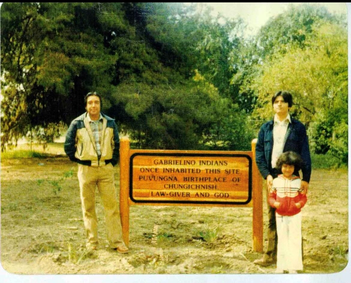 Historical-photo-1970-Puvungna-sign-with-2-men-and-a-kid.jpg
